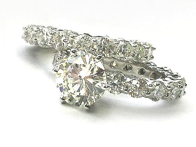 Ladies 14K White Gold Eternity Ring with 3.02 ct Round Brilliant-Cut Diamond in Center along with a matching Eternity Band